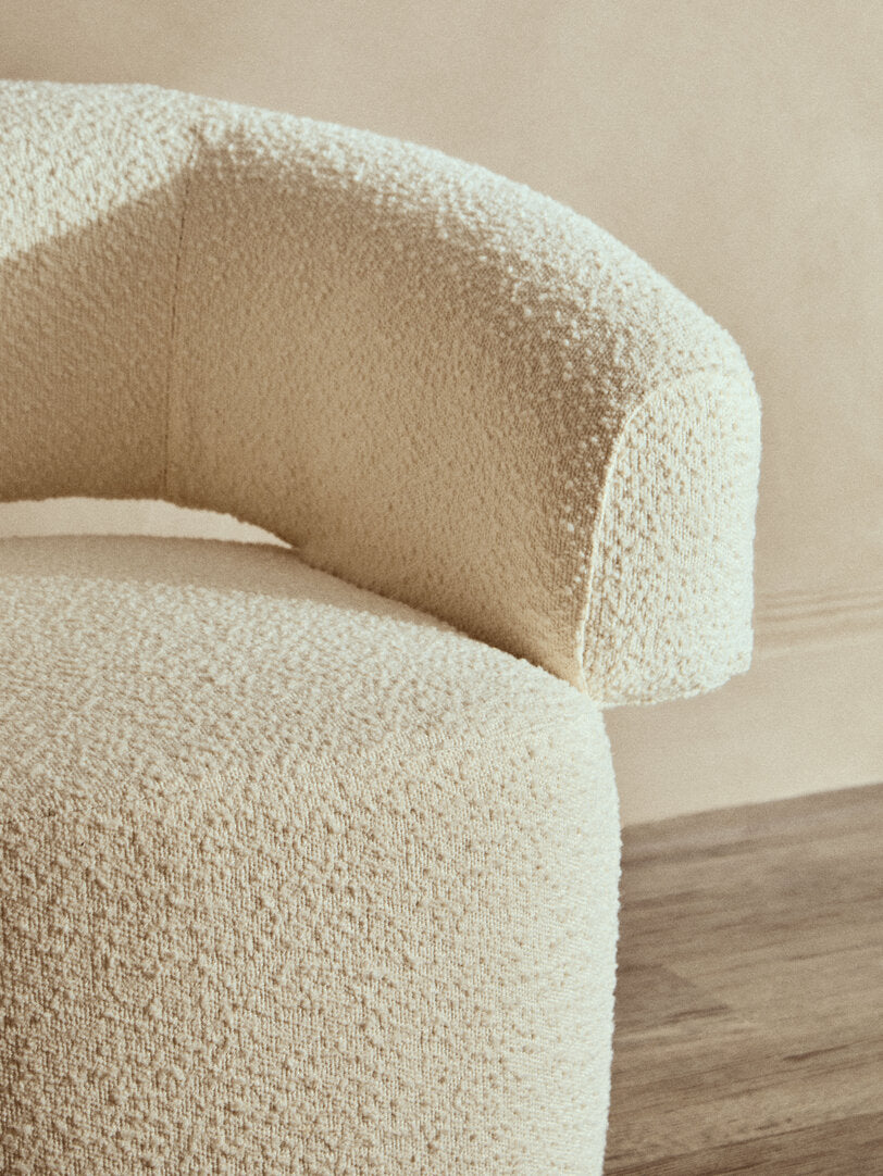 Oliveto Ivory Bouclé Swivel Armchair – Curved Sculptural Seating for Design-Led Workspaces